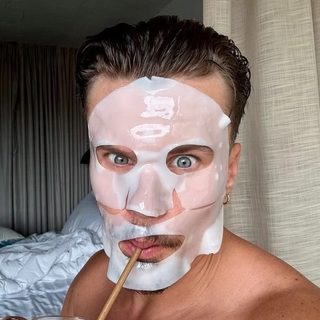 Peter Groff wearing a sheet face mask